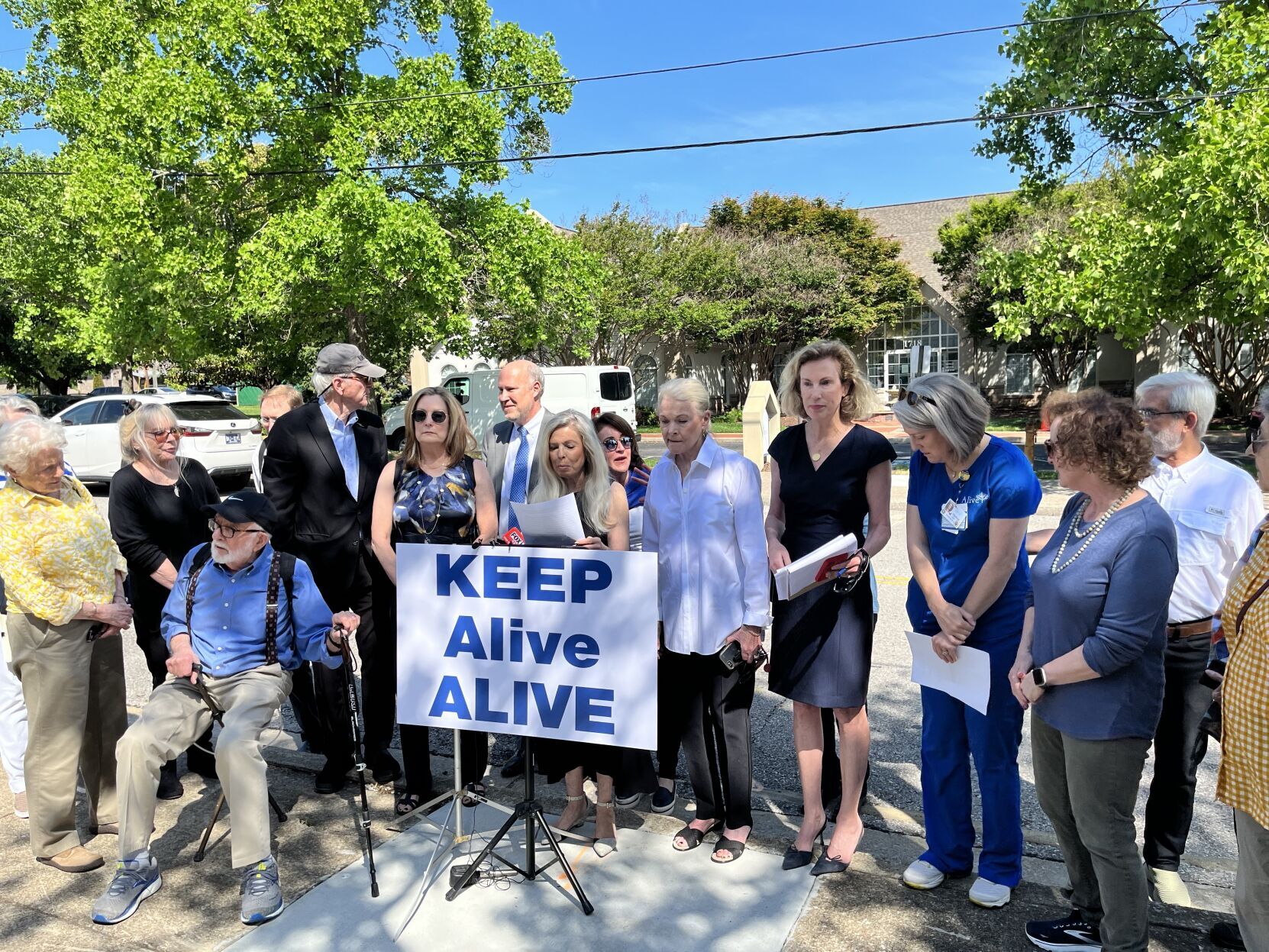 Opponents of a possible Alive Hospice sale gathered for a press conference last month